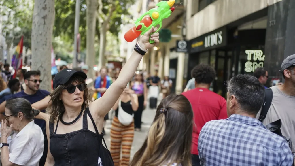 Spaniards flip aqua pistols on guests to protest tourism : NPR Spaniards flip aqua pistols on guests to protest tourism : NPR