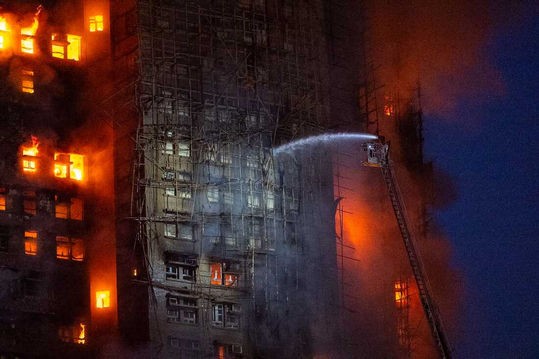 13 people killed in fire engulfing Hong Kong high-rise residential buildings, fire services say : NPR