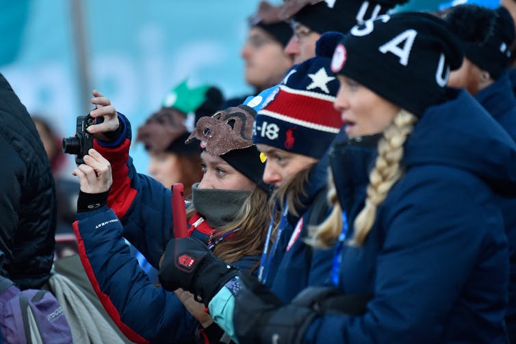 Winter Olympians often compete in freezing temperatures – physiology and advances in materials science help keep them warm
